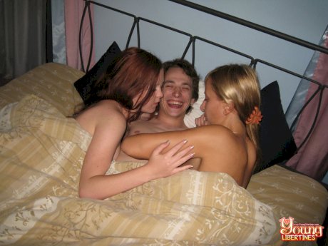 Young bisexed girls hop into bed with their fuck buddy for a threesome