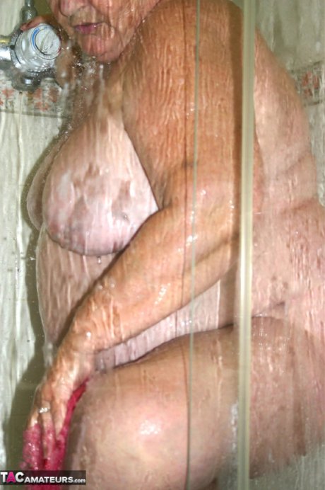 Obese granny Grandma Libby fondles her naked body while taking a shower