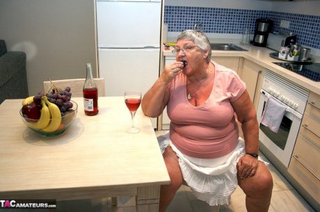 Mature BBW Grandma Libby strips in the kitchen to wine & dine & toy pussy nude