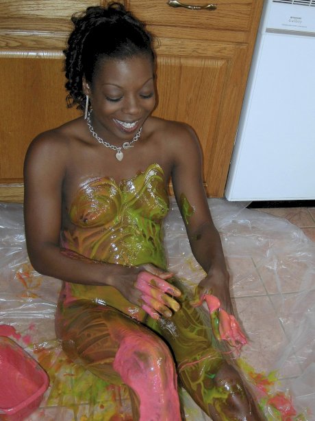 Ebony amateur Anastasia covers her hot body with paint in the kitchen
