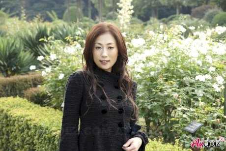 Fully clothed Japanese teen models in the park in black clothes and stockings