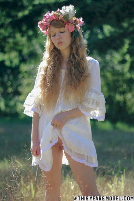 Charming redheaded teen Dolly Little holds a parasol while getting naked - Photo 7