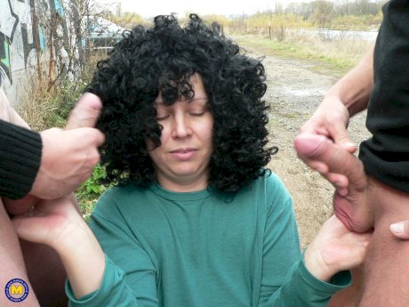 Curly-haired amateur prostitute with big tits Johanna sucks 2 dicks in public - Photo 12