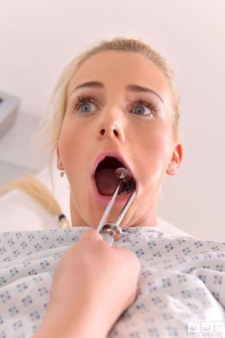 Blonde girl undergoes an anal exam and strapon fucking from a lesbian doctor