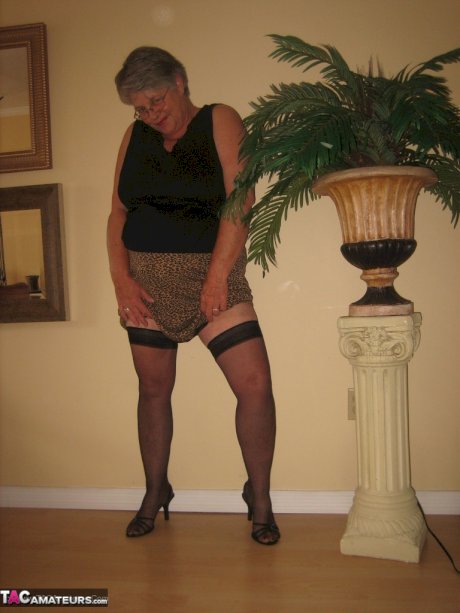 Old oma Girdle Goddess unleashes her huge tits before toying her pussy