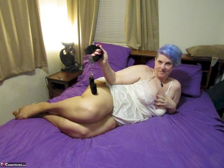 Fat granny Bunny Gram works free of handcuffs before sucking cock on her bed