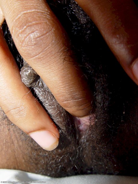 Exotic ebony beauty Satya shows her big tits & fingers her hairy twat