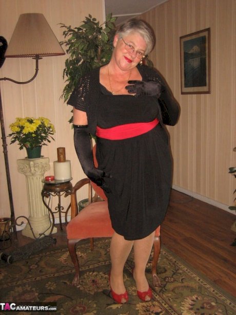 Old fatty Girdle Goddess fondles saggy tits in black velvet gloves and hose - Photo 1