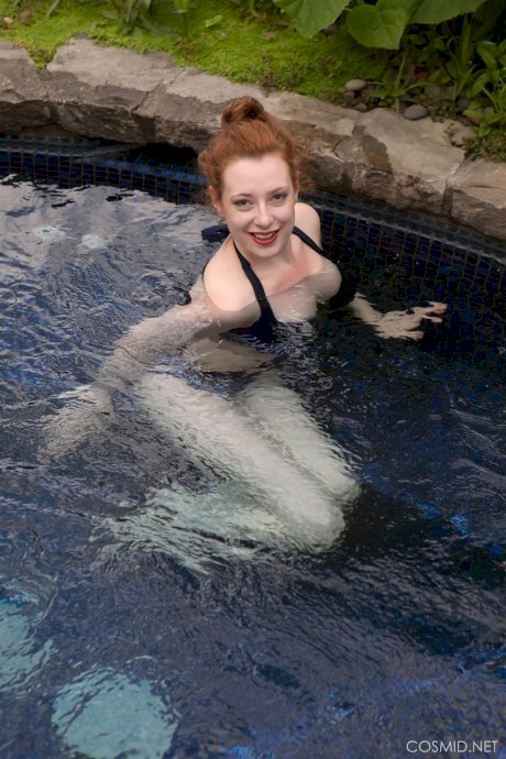 Pale redhead Misha Lowe shows her big naturals and bare ass in hot tub