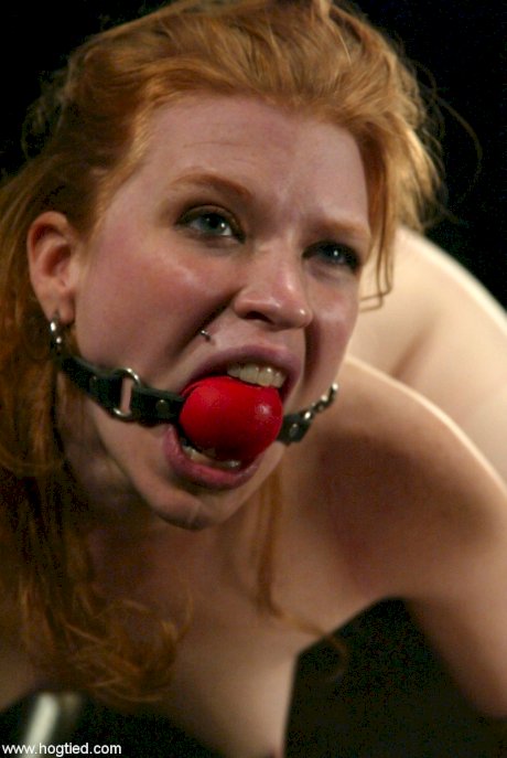 Ball-gagged MILF Madison Young endures wild BDSM action with a machine dildo