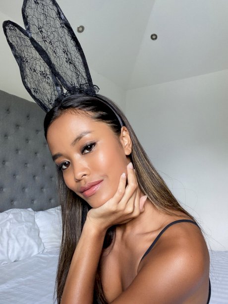 Adorable petite babe Putri Cinta flaunts her fake tits wearing bunny ears