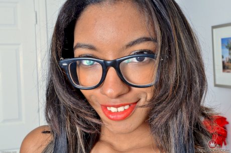 Black amateur Raven Wilde shows off the pink of her pussy with glasses on