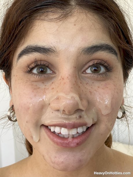 Young amateur takes a cumshot on her freckled face during POV action