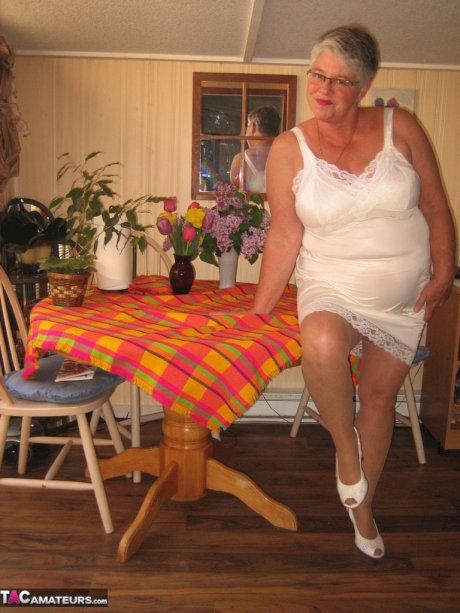 Fat granny Girdle Goddess exposes her huge boobs in a girdle and nylons