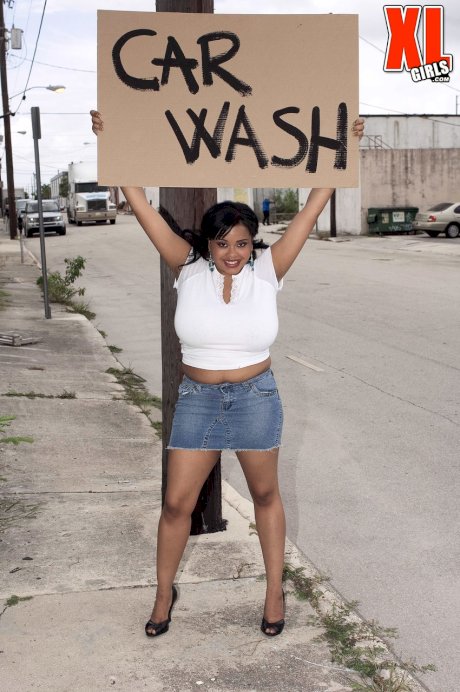 Black BBW Sunny Dee soaps up her massive boobs while running a car wash