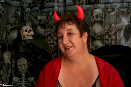 Mature fatty Kinky Carol uncovers her huge tits at Halloween