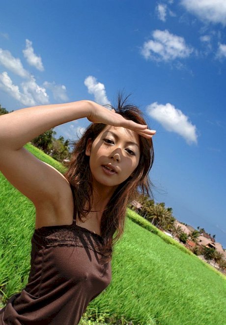 Young Japanese girl Honoka exposes her great tits in the countryside