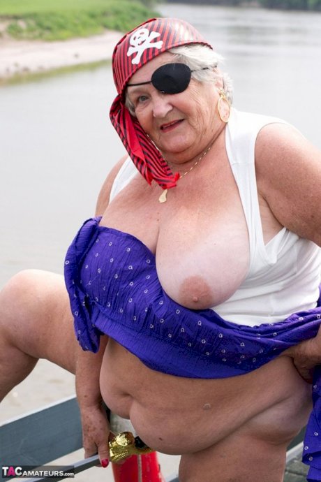 Fat British granny exposes herself on a bridge while sporting pirate attire