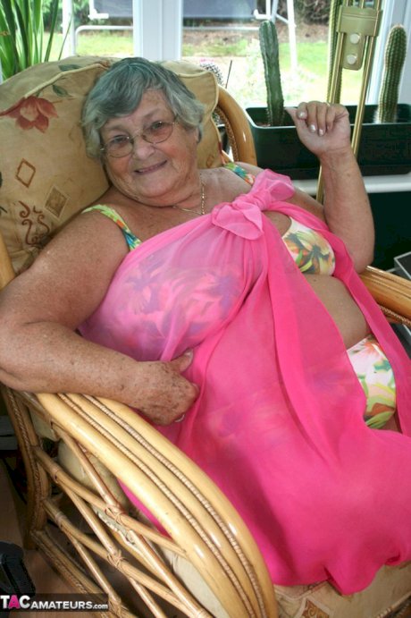 Horny old granny in glasses disrobes to reveal huge saggy tits & big BBW ass