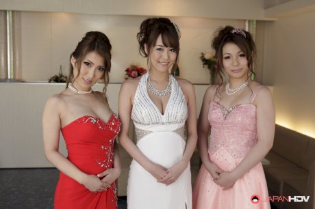 Three totally naked Japanese beauties don elegant evening wear