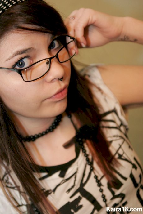 Solo girl Kaira 18 takes off her glasses while fully clothed porn pics