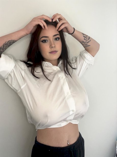 Adorable blue eyed teen with huge juggs Brooke Mills poses in a tight shirt