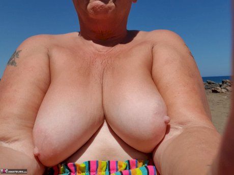 Old SSBBW Val Gasmic dyes her hair red before exposing herself on the beach
