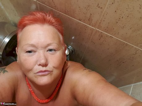 Fat granny with red hair Valgasmic Exposed takes naked selfies at home