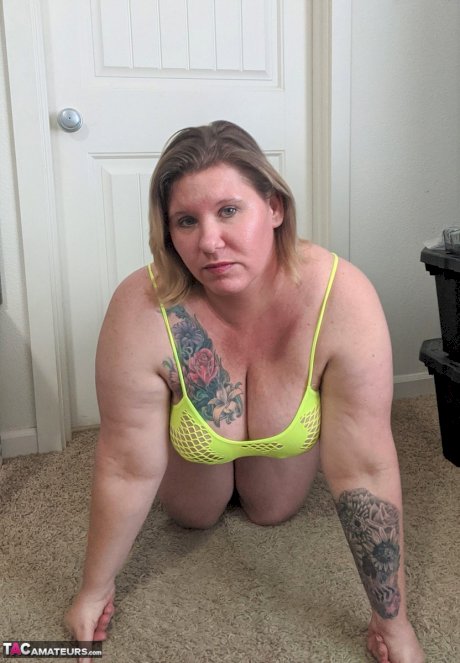 Fat amateur Busty Kris Ann gets naked while changing lingerie in a bedroom