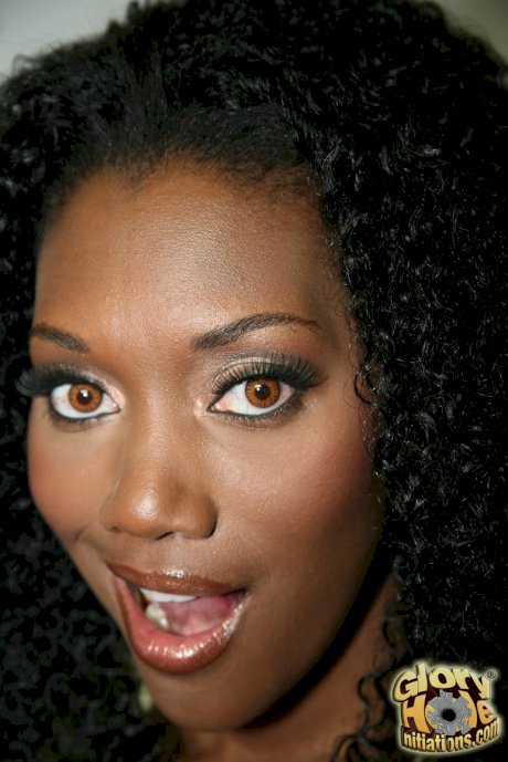 Hot ebony Nyomi Banxxx blows a big cock & takes a facial through a gloryhole - Photo 1