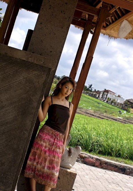 Young Japanese girl Honoka exposes her great tits in the countryside
