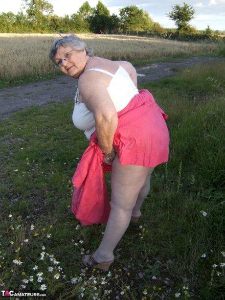 Obese oma Grandma Libby exposes her huge ass while in a field by a rural road