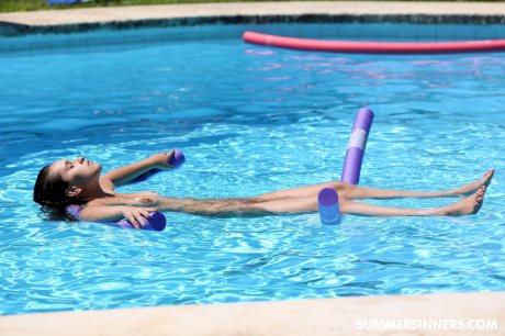 Redheaded Czech babe Chrissy Fox gives head during a naked swimming session porn pics