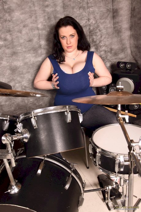 Female drummer Anna Beck unleashes her massive breasts during a solo gig