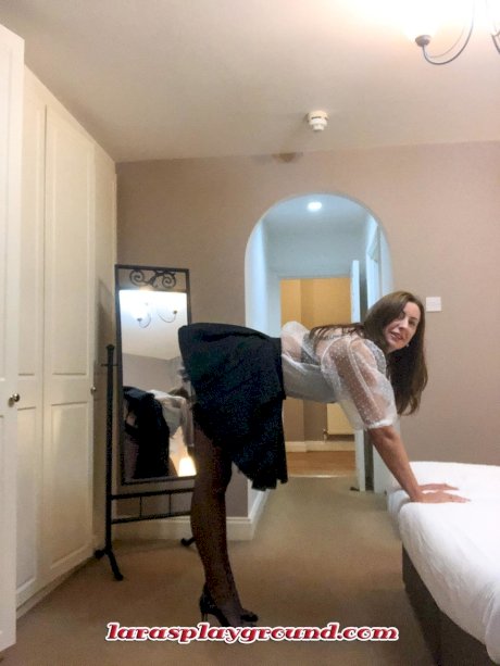 Hot MILF Lara shows her big boobs while trying on various sexy lingerie sets