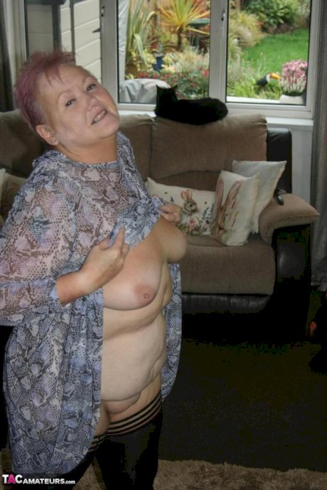 Fat nan Valgasmic Exposed casts off her dress to go naked in black stockings