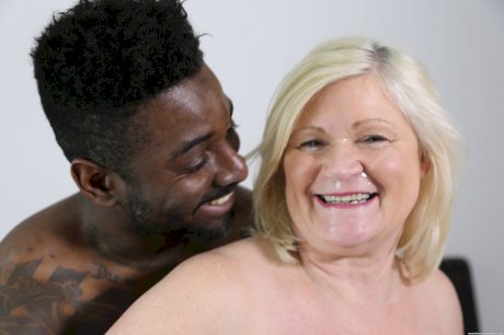 Big-breasted granny Lacey Starr ends wild interracial action with a facial
