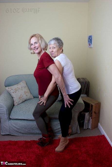 Old lesbians suck on each others boobs after modeling fully clothed