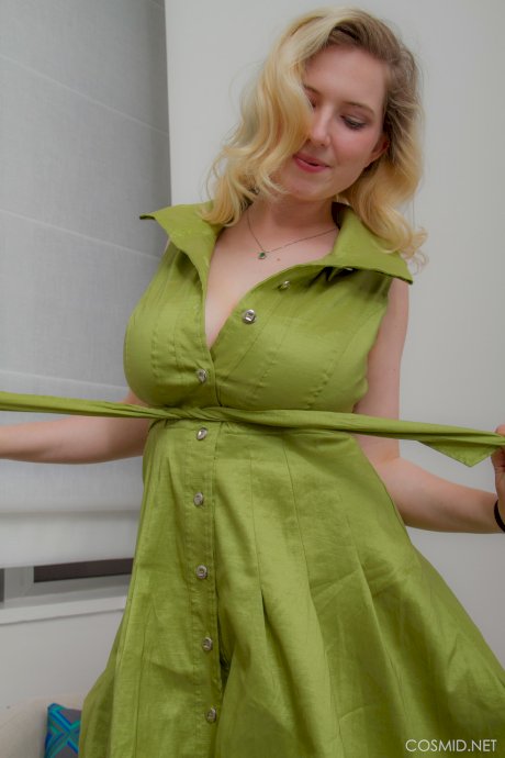 Blonde amateur Mim Turner releases her big natural tits as she removes dress