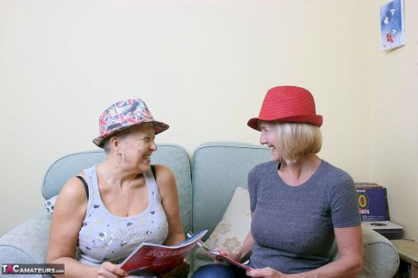 Two old lesbians exposes their big boobs and bare asses together