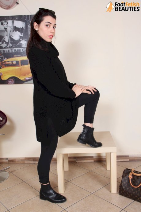 Clothed female Petra removes her boots and socks to show her pretty feet - Photo 3