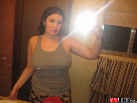 Amateur solo girl takes mirror selfies of her large breasts