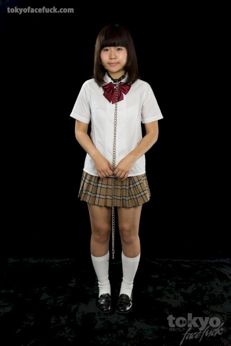 Japanese student is restrained while being mouth fucked on her knees