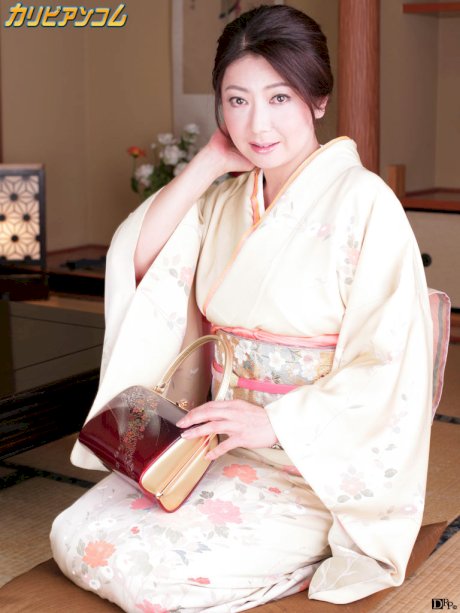 Japanese lady Ayano Murasaki receives a facial while posing in her lingerie