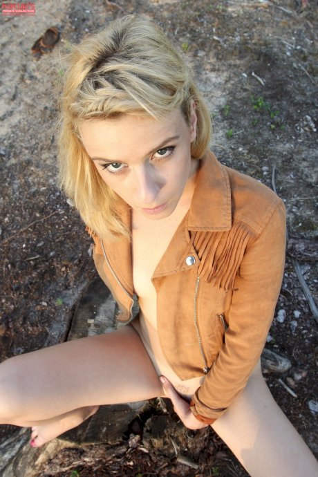 Natural blonde Amy Shangela shows her bald pussy on a tree stump near the woods - Photo 8