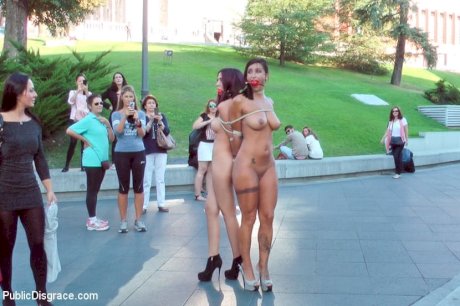 Beautiful girls are tied together during a public humiliation session - Photo 8