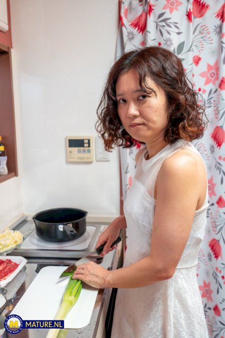 Mature housewife with a shaved pussy and firm tits in the kitchen having sex - Photo 7