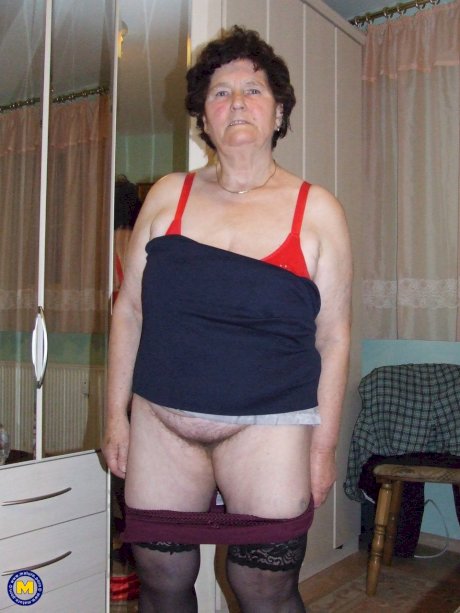 Old BBW Hildegard reveals her big naturals and hairy crotch in her bedroom