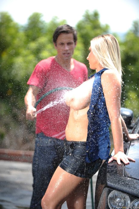 Blonde cougar Devon Lee shows her huge juggs and gets rammed at a car wash