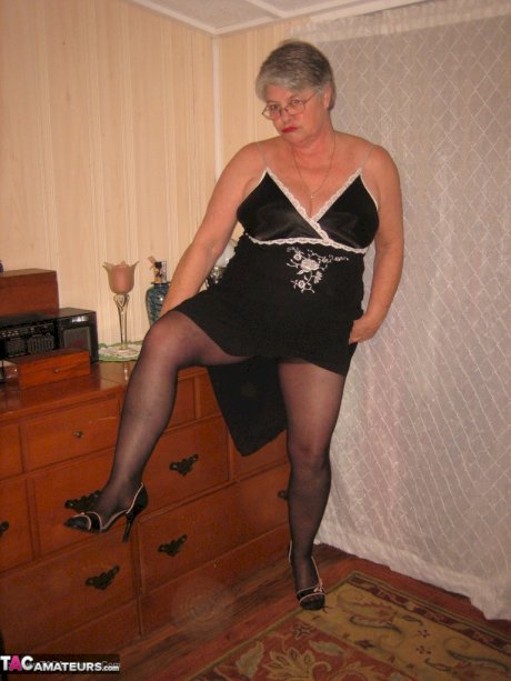 Overweight nan Girdle Goddess strips to her footwear in front of a dresser